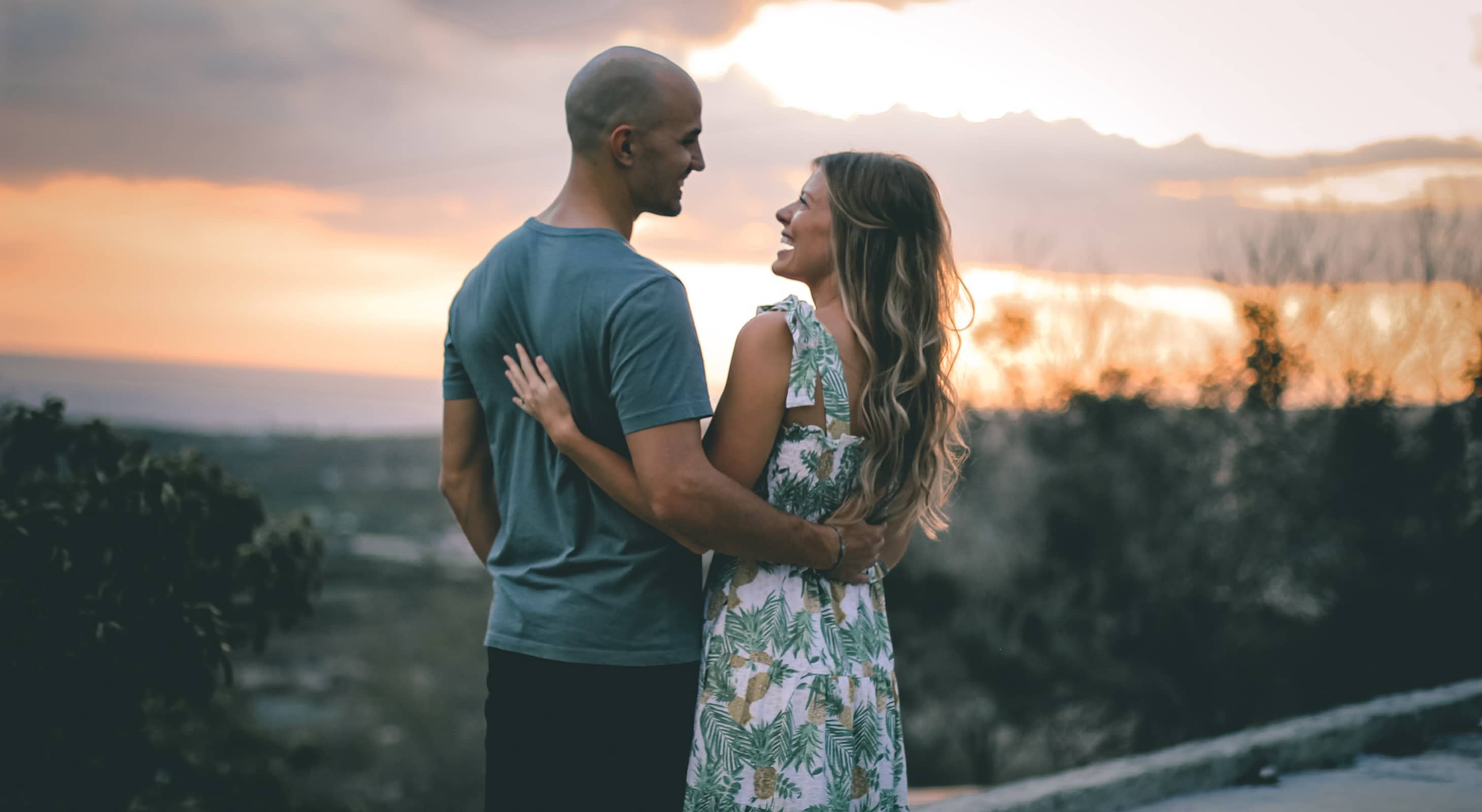 A couple watching the Tucson sunset after dinner at a romantic restaurant in Tucson